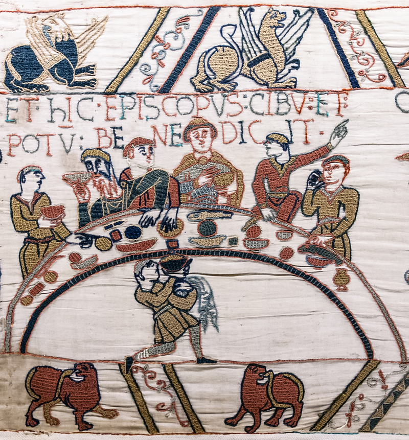 Tapisserie de Bayeux - Scène 43 : l'évêque Odon bénit le banquet.